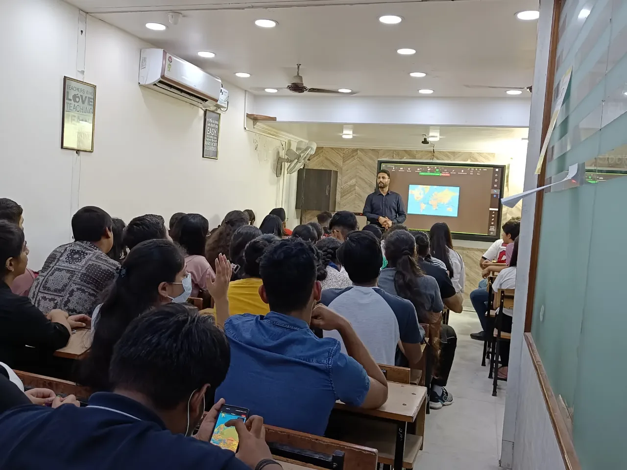 ISL faculty teaching a full classroom at the South Delhi centre