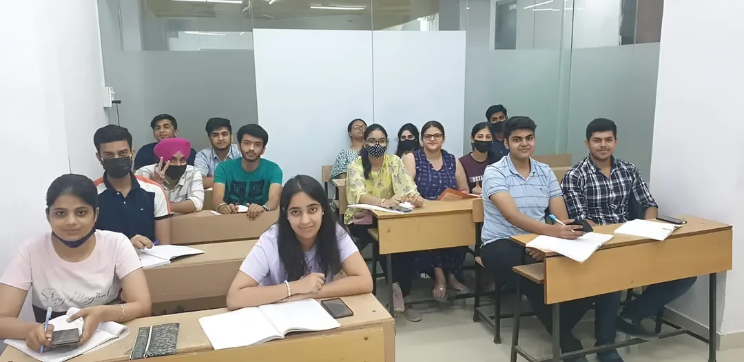 Students working through an assessment paper at ISL